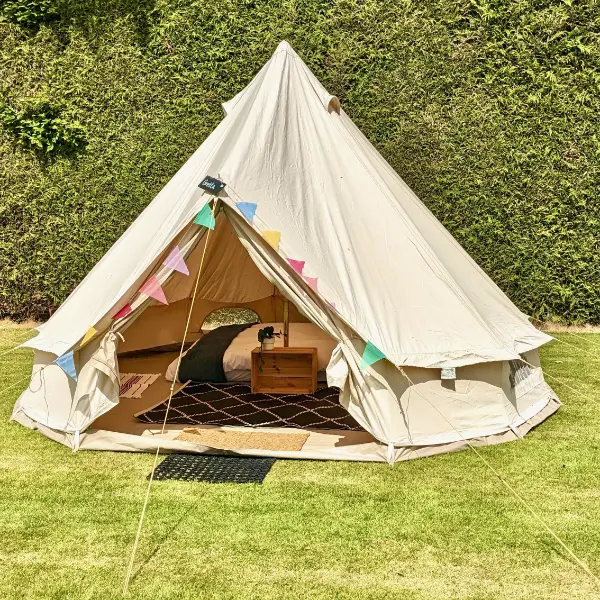 Cute bell tent with bunting from the outside