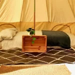Birthday Party Bell Tent Hire: A Brilliant Way to Celebrate 4 - Brilliant Bell Tent Hire Cosy bell tent interior with bedding.